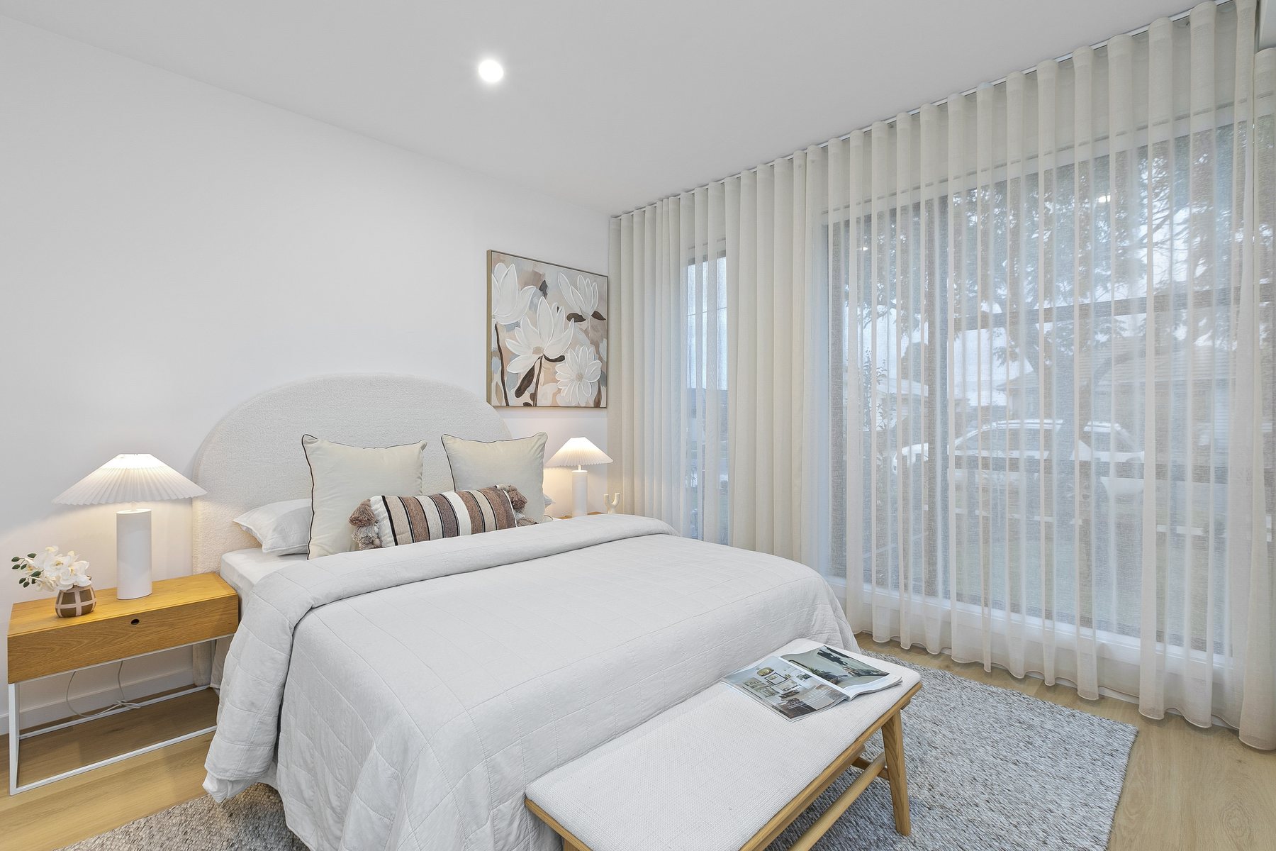 Main bedroom with sheer curtains