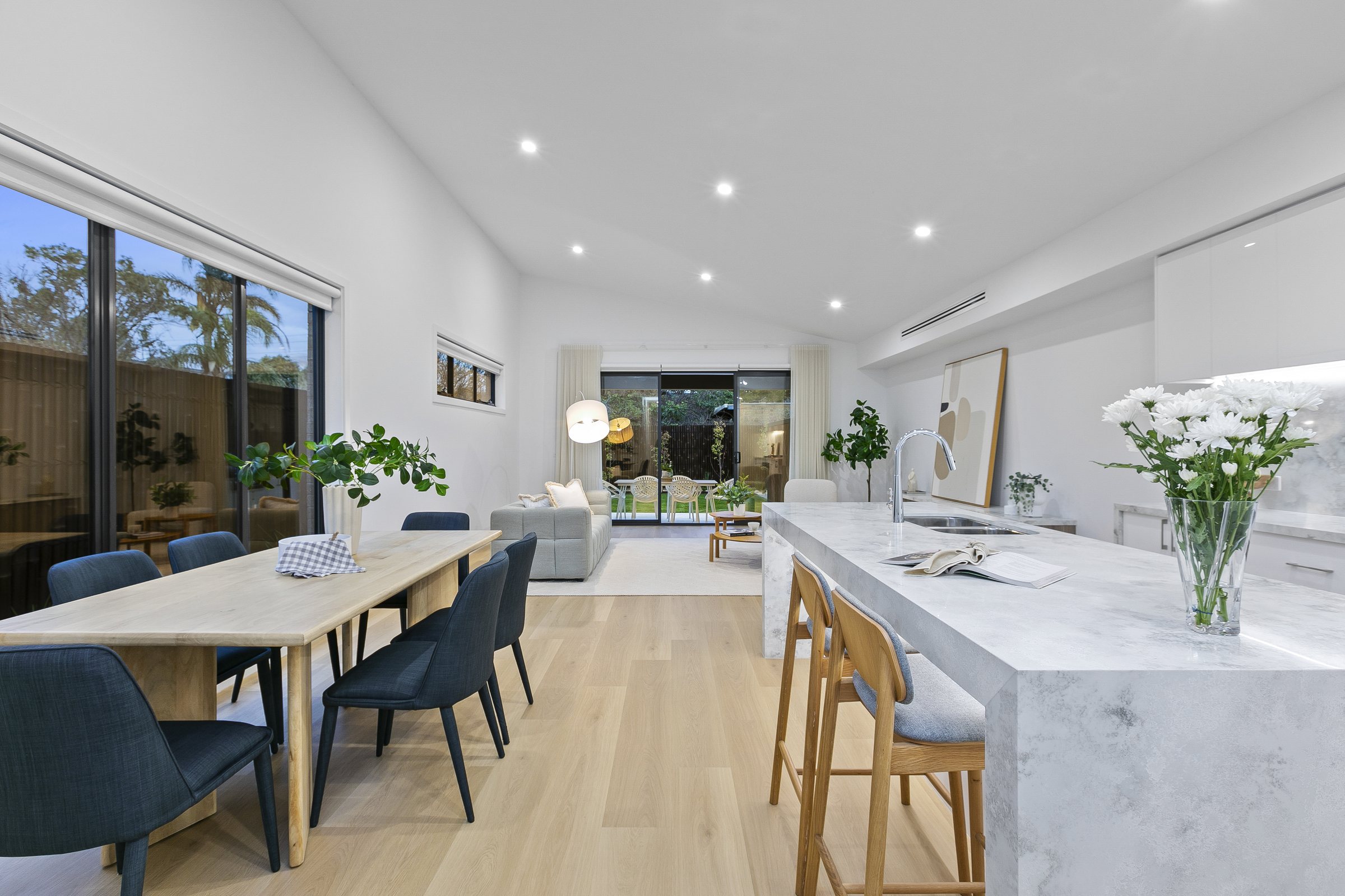 Open plan kitchen, dining and living under the raked ceiling